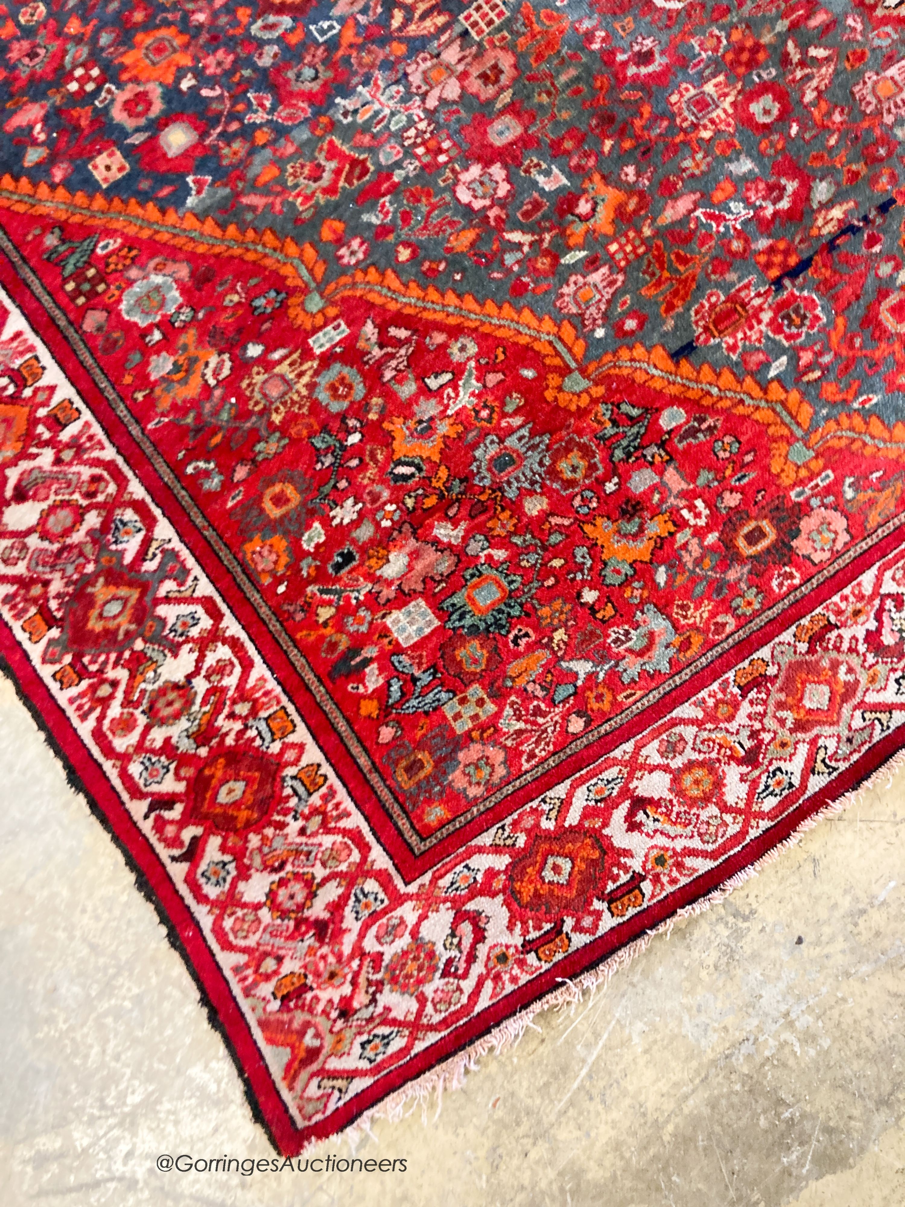 A North West Persain red ground rug, 200 x 132cm